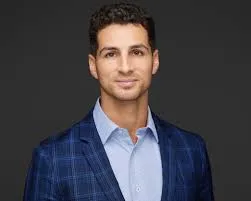 A professional content creator headshot.